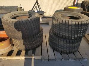 lot 15A image: Lot of (4) Bobcat Turf  Sand 33x15.50-16.5 Skid Steer Turf Tires  with One 8-Lug Steel Wheel