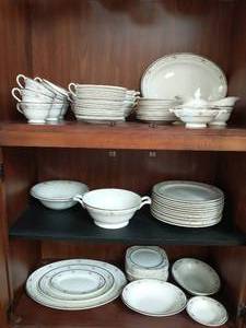 lot 123 image: Collection of Edwin M. Knowles China. Some small chips on the rims. Cabinet is sold separately lot #109.