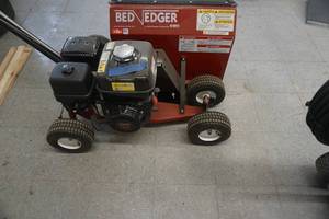 lot 23 image: Brown Bed Edger Model F991 Commercial Bed Edger