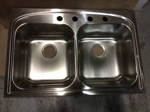 lot 32 image: Pergola Drop-In Stainless Steel 33 in. 4-Hole Double Bowl Kitchen Sink by Elkay Customer Returns See Pictures