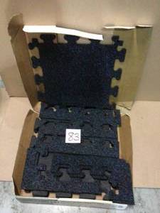 lot 83 image: Black with Blue Flecks 18 in. x 18 in. x 0.3 in. Rubber GymWeight Room Flooring Tiles (14.32 sq. ft.) by TrafficMaster Customer Returns See Pictures