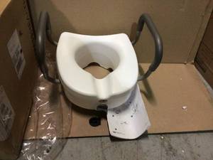 lot 88 image: E-Z Lock Raised Toilet Seat with Armrests by Carex Health Brands Customer Returns See Pictures