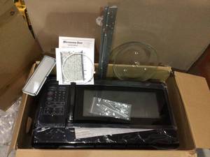 lot 89 image: 1.6 cu. ft. Over the Range Microwave in Black by Unbranded Customer Returns See Pictures
