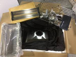 lot 19 image: All-in-One Drop-In Stainless Steel 27 in. 4-Hole Single Bowl Kitchen Workstation Sink with Accessories Kit by Glacier Bay Customer Returns See Pictures 