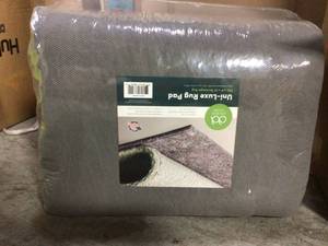 lot 94 image: Uni-Luxe 9 ft. x 12 ft. Anti-Slip Rug Pad by Unique Loom Customer Returns See Pictures 
