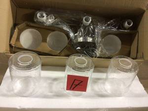 lot 17 image: Winslow 3-Light Brushed Nickel Vanity Light with Clear Seeded Glass Customer Returns See Pictures 