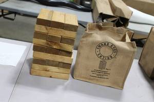 lot 1092 image: Wood Snake Eyes Bricks Yard Game  with Carry Bag