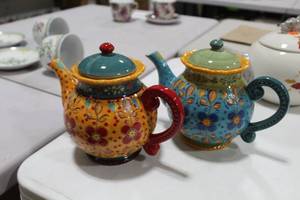 lot 1040 image: Lot of (2) Coastline Imports Dutch Wax Handpainted Ceramic Tea Pots