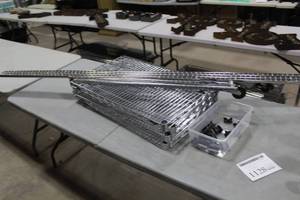 lot 1128 image: Wire Shelfing Parts  with Wire Shelves 30x18 (x4), Poles 75L (x4 one with caster), Stoppers (x10)