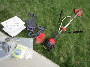 lot 11 image: Jonsered string trimmer with brush ...