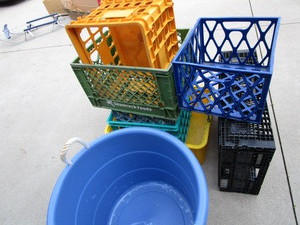 lot 468 image: Plastic milk crates - 5, two plasti...