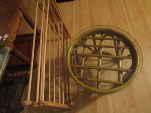 lot 521 image: Round glass top rattan table 21x13...