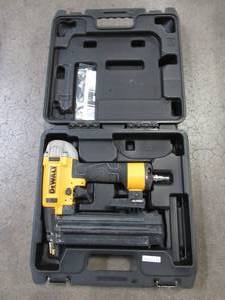 lot 9 image: DEWALT 18-Gauge Pneumatic Brad Nailer, DWFP12233 - Used.