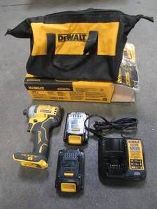 lot 33 image: DEWALT ATOMIC 20-Volt MAX Cordless Brushless Compact 14 in. Impact Driver, (2) 20-Volt 1.3Ah Batteries, Charger & Bag, DCF809C2, Used.