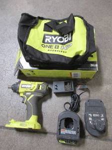 lot 46 image: RYOBI ONE HP 18V Brushless Cordless Compact 14 in. Impact Driver Kit with (1) 1.5 Ah Battery, Charger and Bag, PSBID01K - Used.