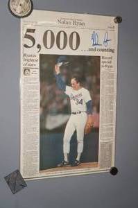 lot 114 image: Nolan Ryan Signed Laminated Newspaper Page