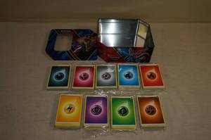 lot 96 image: Metal Pokemon Tin with Unused Energy Cards