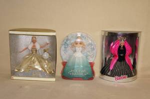 lot 130 image: 3 Holiday Barbie Dolls