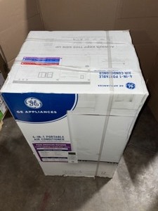 lot 31 image: GE 13,000 BTU (9,450 BTU, DOE) PORTABLE AIR CONDITIONER WITH HEAT PUMP, DEHUMIDIFIER AND REMOTE IN WHITE. SEE PICTURES