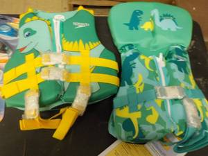 lot 50 image: Life vest, goggles, and swim caps...