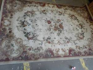 lot 171 image: area rug 63x94 needs cleaning...