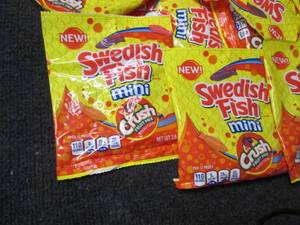 lot 61 image: 12- 3.6 oz Bags of Swedish Fish Min...