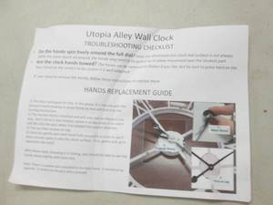 lot 86 image: utopiia alley wall clock scuffed up...