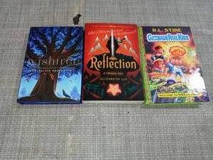 lot 63 image: Welcome to Smellville (Garbage Pail Kids Book 1) - by R L Stine (Hardcover), Reflection - (Twisted Tale) by Elizabeth Lim, Wishtree - by Katherine Applegate (Hardcover)- not used