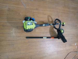lot 64 image: 25cc 2-Cycle Attachment Capable Full Crank Straight Gas Shaft String Trimmer by RYOBI- used