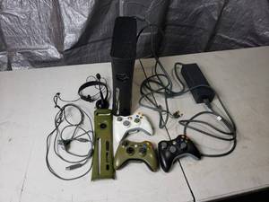 lot 85 image: Black XBox 360 and Controllers