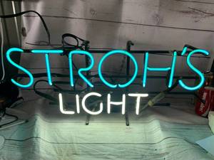 lot 28 image: Strohs Light Neon Sign Approximately 12 X 27 (no shipping)