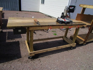 lot 10 image: (1) 2x7x65 Rolling Shelving (1)30x8x43 Rolling Workbench wMiter Saw & Vise