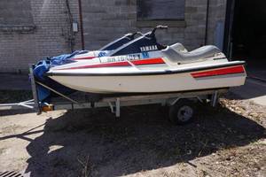 lot 1 image: 2 - Yamaha Wave Runner LXs With Tandem Aluminum Jet Ski Trailer
