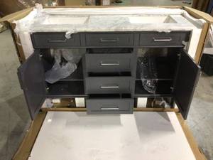 lot 26 image: Sonoma 60 in. W x 22 in. D Double Bath Vanity in Dark Charcoal with Carrara Marble Top with White Sinks by Home Decorators Collection Damaged Only Broken on Granite  Customer Returns See Pictures