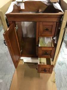 lot 34 image: Naples 25 in. W x 22 in. D Vanity in Warm Cinnamon  by Home Decorators Collection Top NOT included Customer Returns See Pictures