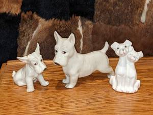 lot 144 image: White Porcelain Dog Figurines