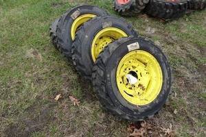 lot 37 image: Skid Steer Rims and Tires