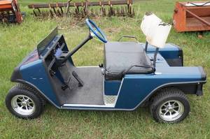 lot 29 image: Blue EZ-Go Gas Powered  Golf Cart