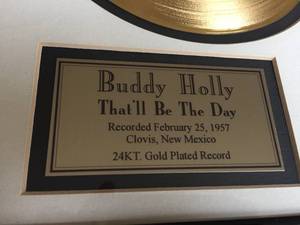 lot 76 image: Buddy Holly Thatll Be The Day Framed Photo with Gold Plated Record