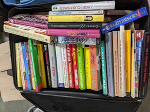 lot 207 image: Rolling Suitcase Filled with (You Guessed It) Books