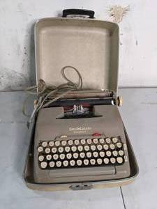 lot 72 image: Smith-Corona Electric Portable Typewriter w Travel Case