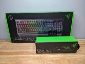 lot 21 image: New Razer Ornata Chroma Mecha-Membrane Gaming Keyboard & Goliathus Speed Cosmic Mouse Pad