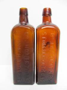 lot 322 image: Pair of Original Antique Dr. Hostetters Stomach Bitters Advertising Glass Bottles