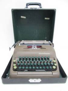 lot 224 image: Vintage Smith Corona Sterling Portable Typewriter wCase