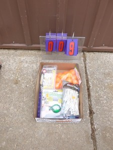 Flat of golf accessories. As shown.