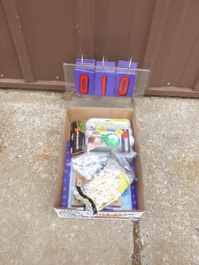 Flat of golf accessories. As shown.