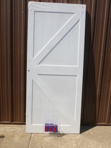 36 x 84 Barn door. No brackets or rail included. Has minor scuffs & dings. As shown.