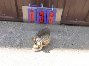 Mohawk skull figurine. As shown.