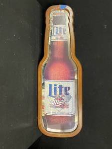 lot 136 image: Miller Lite bottle shaped mirror in wood frame
