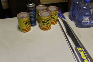 lot 85 image: Lot of (7) Automotive Accessories    with Vintage Red Owl Motor Oil 1 Qt Can (x3 full, x1 empty), Traveller Brake Pad Cleaner (x1), Wiper Blade Replacement Sets (22 x1, 20 x1)